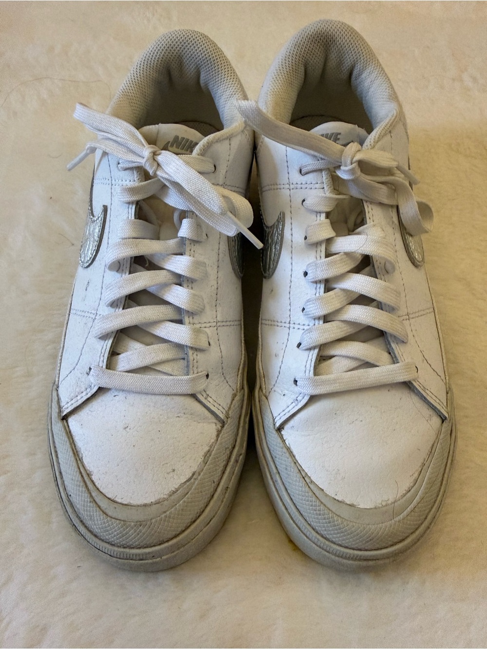 Nike White Sneakers with Silver Swoosh Accents